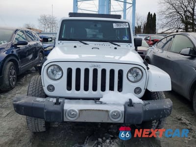 Piąte zdjęcie samochodu w środku: 2015 JEEP WRANGLER UNLIMITED SAHARA VIN:1C4BJWEGXFL742668 - miniatura