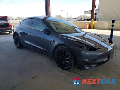 Czwarte zdjęcie samochodu z boku: 2023 TESLA MODEL 3 VIN:5YJ3E1ECXPF691315 - miniatura