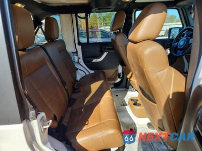 Zdjęcie 11 z 14 samochodu: 2012 JEEP WRANGLER UNLIMITED SAHARA VIN:1C4HJWEG9CL279685 - miniatura