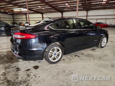 Trzecie zdjęcie samochodu z tyłu: 2018 FORD FUSION S HYBRID VIN:3FA6P0UU2JR170516 - miniatura