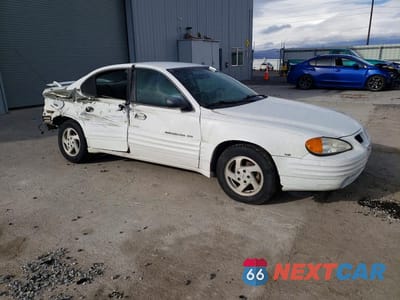 Czwarte zdjęcie samochodu z boku: 1999 PONTIAC GRAND AM SE VIN:1G2NE52E2XC508402 - miniatura