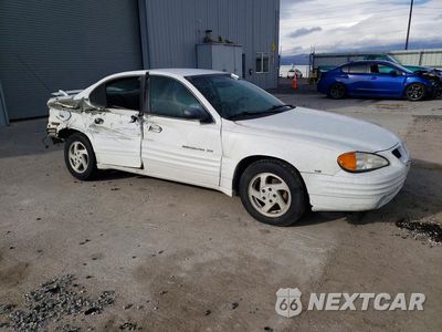 Czwarte zdjęcie samochodu z boku: 1999 PONTIAC GRAND AM SE VIN:1G2NE52E2XC508402 - miniatura
