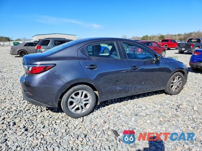 Trzecie zdjęcie samochodu z tyłu: 2016 SCION IA BASE VIN:3MYDLBZV9GY106774 - miniatura