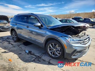 Czwarte zdjęcie samochodu z boku: 2023 VOLKSWAGEN TIGUAN SE VIN:3VV2B7AX4PM065871 - miniatura