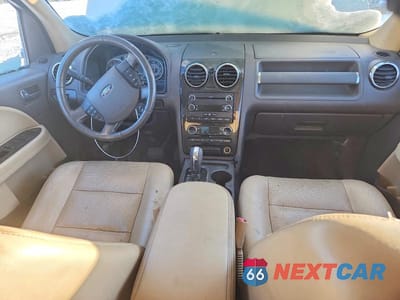 Zdjęcie 8 z 12 samochodu: 2008 FORD TAURUS X SEL VIN:1FMDK05W08GA04282 - miniatura