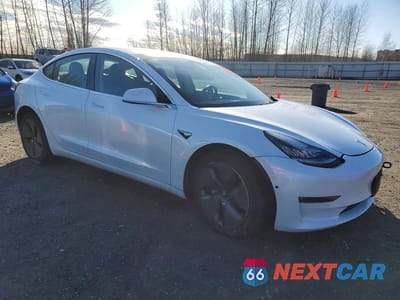 Czwarte zdjęcie samochodu z boku: 2019 TESLA MODEL 3 VIN:5YJ3E1EB1KF408316 - miniatura