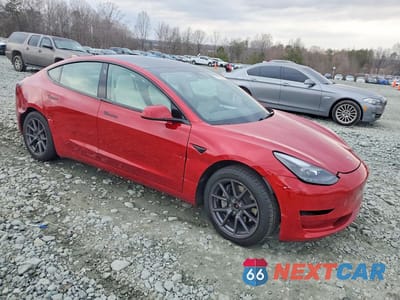 Czwarte zdjęcie samochodu z boku: 2023 TESLA MODEL 3 VIN:5YJ3E1EB1PF620124 - miniatura