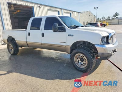 Czwarte zdjęcie samochodu z boku: 2002 FORD F250 SUPER DUTY VIN:1FTNW21F82ED57063 - miniatura