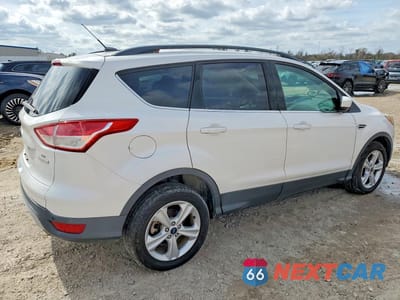 Trzecie zdjęcie samochodu z tyłu: 2016 FORD ESCAPE SE VIN:1FMCU0G91GUC77809 - miniatura