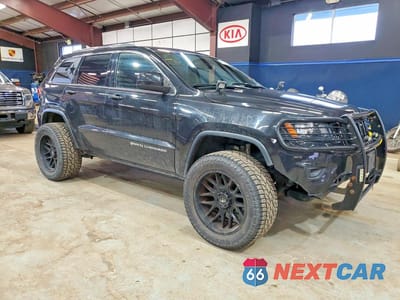 Czwarte zdjęcie samochodu z boku: 2014 JEEP GRAND CHEROKEE LAREDO VIN:1C4RJFAGXEC269390 - miniatura