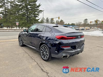 Czwarte zdjęcie samochodu z boku: 2020 BMW X6 M50I VIN:5UXCY8C08L9B21442 - miniatura