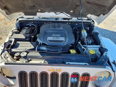 Zdjęcie 12 z 14 samochodu: 2012 JEEP WRANGLER UNLIMITED SAHARA VIN:1C4HJWEG9CL279685 - miniatura