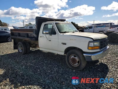Czwarte zdjęcie samochodu z boku: 1992 FORD F350 DUMP TRUCK VIN:2FDJF37G6NCA17940 - miniatura