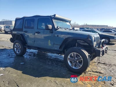 Czwarte zdjęcie samochodu z boku: 2014 JEEP WRANGLER UNLIMITED RUBICON VIN:1C4HJWFG0EL134861 - miniatura