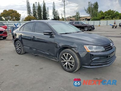 Czwarte zdjęcie samochodu z boku: 2017 VOLKSWAGEN JETTA SE VIN:3VWDB7AJ3HM365659 - miniatura