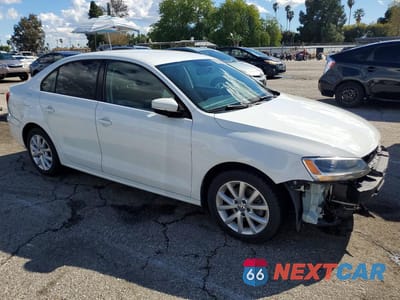 Czwarte zdjęcie samochodu z boku: 2014 VOLKSWAGEN JETTA SE VIN:3VWD17AJ9EM404057 - miniatura