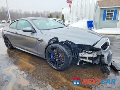 Czwarte zdjęcie samochodu z boku: 2015 BMW M6 VIN:WBSLX9C51FD160662 - miniatura