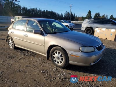 Czwarte zdjęcie samochodu z boku: 1999 CHEVROLET MALIBU LS VIN:1G1NE52M6X6118493 - miniatura