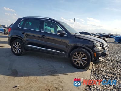 Czwarte zdjęcie samochodu z boku: 2017 VOLKSWAGEN TIGUAN WOLFSBURG VIN:WVGRV7AX2HK002731 - miniatura
