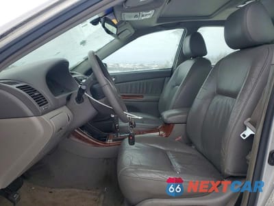 Zdjęcie 7 z 12 samochodu: 2003 TOYOTA CAMRY LE VIN:4T1BF32K93U551642 - miniatura