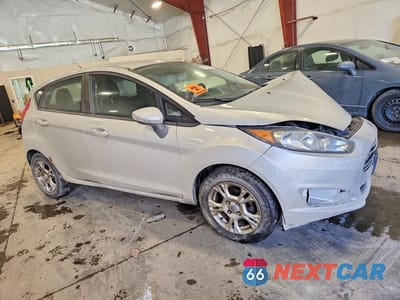 Czwarte zdjęcie samochodu z boku: 2014 FORD FIESTA SE VIN:3FADP4EJ0EM158984 - miniatura