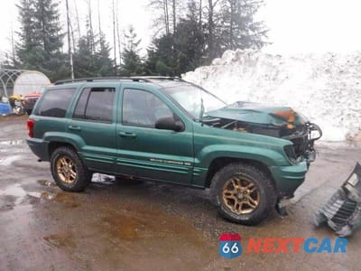 Czwarte zdjęcie samochodu z boku: 1999 JEEP GRAND CHEROKEE LIMITED VIN:1J4GW68N3XC639363 - miniatura