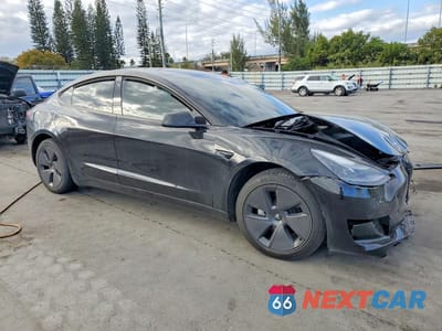 Czwarte zdjęcie samochodu z boku: 2023 TESLA MODEL 3 VIN:5YJ3E1EA3PF396197 - miniatura