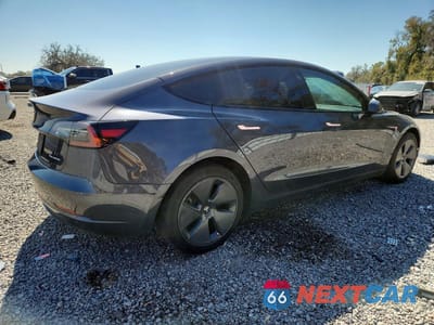Trzecie zdjęcie samochodu z tyłu: 2023 TESLA MODEL 3 VIN:5YJ3E1EB2PF391839 - miniatura