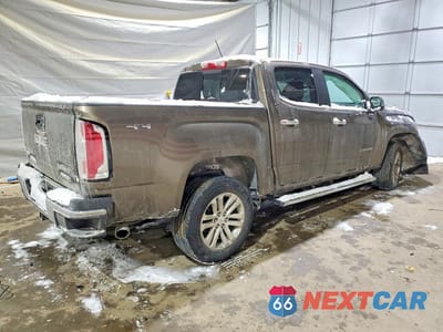 Trzecie zdjęcie samochodu z tyłu: 2016 GMC CANYON SLT VIN:1GTG6DE38G1272369 - miniatura