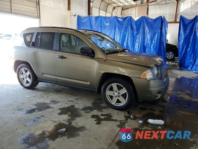 Czwarte zdjęcie samochodu z boku: 2010 JEEP COMPASS VIN:1J8FT47W07D204313 - miniatura