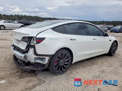 Trzecie zdjęcie samochodu z tyłu: 2022 TESLA MODEL 3 VIN:5YJ3E1EC8NF269671 - miniatura