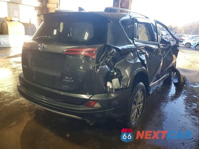 Trzecie zdjęcie samochodu z tyłu: 2018 TOYOTA RAV4 HYBRID XLE VIN:JTMRJREV9JD247928 - miniatura