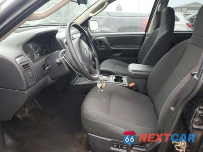 Zdjęcie 7 z 13 samochodu: 2003 JEEP GRAND CHEROKEE LAREDO VIN:1J4GW48S53C563004 - miniatura
