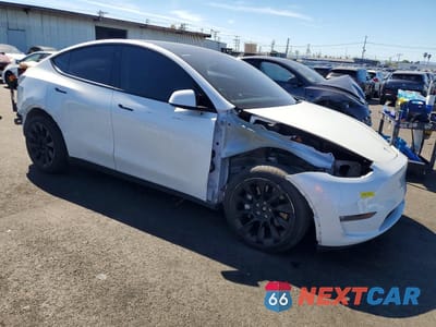 Czwarte zdjęcie samochodu z boku: 2022 TESLA MODEL Y VIN:7SAYGDEE2NF560401 - miniatura