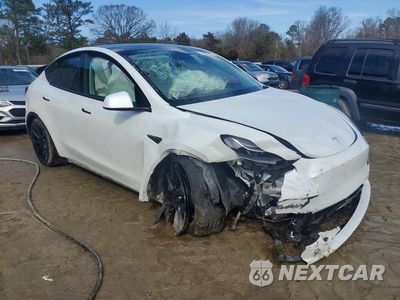 Czwarte zdjęcie samochodu z boku: 2023 TESLA MODEL Y VIN:7SAYGAEE8PF662061 - miniatura