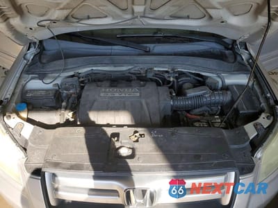 Zdjęcie 12 z 13 samochodu: 2006 HONDA PILOT EX VIN:2HKYF18456H559831 - miniatura