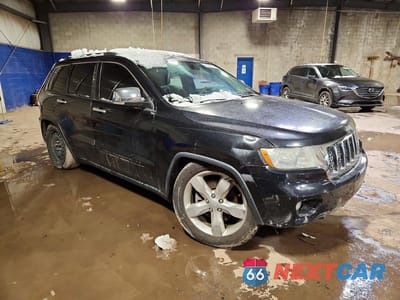 Czwarte zdjęcie samochodu z boku: 2013 JEEP GRAND CHEROKEE OVERLAND VIN:1C4RJFCT9DC600193 - miniatura