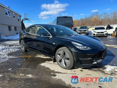 Czwarte zdjęcie samochodu z boku: 2018 TESLA MODEL 3 VIN:5YJ3E1EA9JF056690 - miniatura