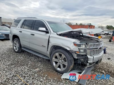 Czwarte zdjęcie samochodu z boku: 2020 CHEVROLET TAHOE C1500 LT VIN:1GNSCBKC0LR129124 - miniatura