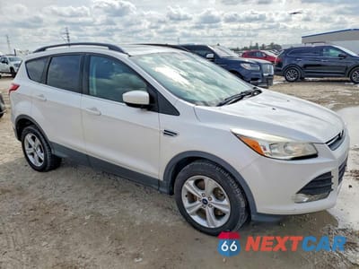 Czwarte zdjęcie samochodu z boku: 2016 FORD ESCAPE SE VIN:1FMCU0G91GUC77809 - miniatura
