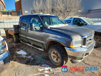 Czwarte zdjęcie samochodu z boku: 2003 FORD F250 FLATBED TRUCK VIN:1FTNW21S23EA53127 - miniatura