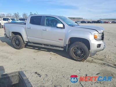 Czwarte zdjęcie samochodu z boku: 2015 GMC CANYON SLE VIN:1GTG6BE3XF1170932 - miniatura