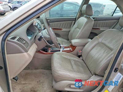 Zdjęcie 7 z 11 samochodu: 2003 TOYOTA CAMRY LE VIN:4T1BE30K03U739195 - miniatura