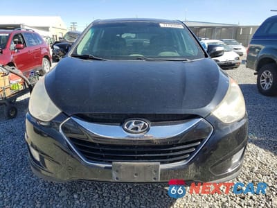 Piąte zdjęcie samochodu w środku: 2010 HYUNDAI TUCSON LIMITED VIN:KM8JUCAC5AU085362 - miniatura