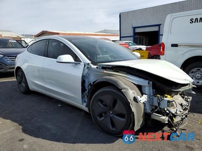Czwarte zdjęcie samochodu z boku: 2020 TESLA MODEL 3 VIN:5YJ3E1EB2LF801064 - miniatura