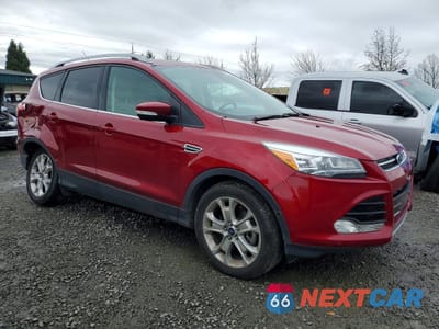 Czwarte zdjęcie samochodu z boku: 2016 FORD ESCAPE TITANIUM VIN:1FMCU9J91GUA95573 - miniatura