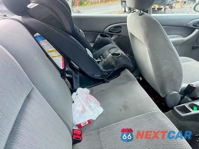 Zdjęcie 11 z 13 samochodu: 2001 FORD FOCUS LX VIN:1FAFP33P71W151227 - miniatura