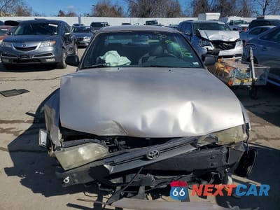 Piąte zdjęcie samochodu w środku: 1995 TOYOTA COROLLA VIN:1NXAE04B1SZ280472 - miniatura