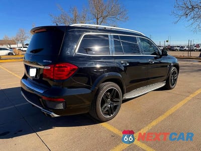 Czwarte zdjęcie samochodu z boku: 2016 MERCEDES-BENZ GL 63 AMG VIN:4JGDF7EE9GA710799 - miniatura
