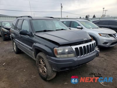 Czwarte zdjęcie samochodu z boku: 2003 JEEP GRAND CHEROKEE LAREDO VIN:1J4GW48S53C563004 - miniatura